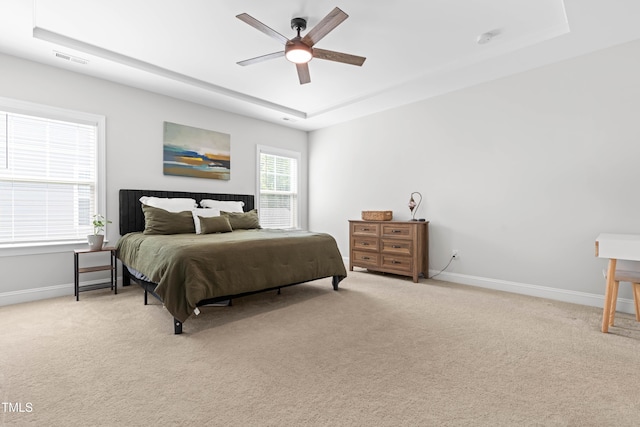279 Edge Of Auburn Blvd, Raleigh, NC 27610 - bedroom featuring a raised ceiling, baseboards, and light colored carpet