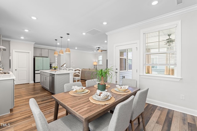 279 Edge Of Auburn Blvd, Raleigh, NC 27610 - dining area featuring recessed lighting, crown molding, dark wood-style flooring, ceiling fan, and baseboards