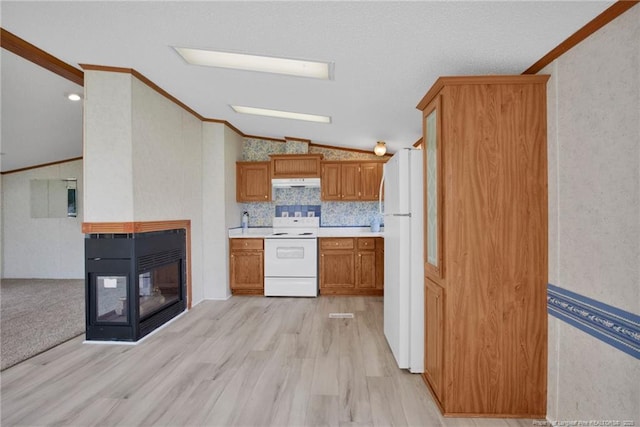 6131 Twiggs Ct, Hope Mills, NC 28348 - kitchen featuring white appliances, vaulted ceiling, ornamental molding, light countertops, and under cabinet range hood