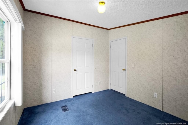 6131 Twiggs Ct, Hope Mills, NC 28348 - unfurnished bedroom featuring ornamental molding, multiple windows, and carpet floors