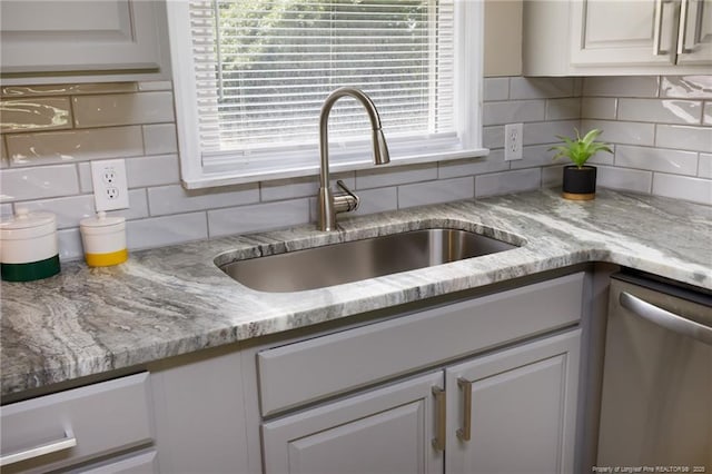 408 Harril Cir, Spring Lake, NC 28390 - kitchen with a sink, stainless steel dishwasher, and decorative backsplash