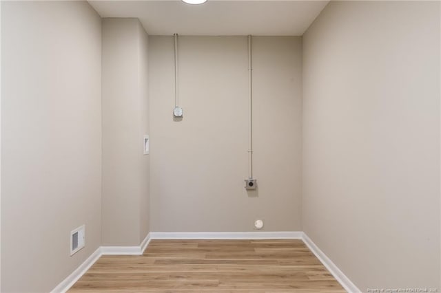 408 Harril Cir, Spring Lake, NC 28390 - washroom with electric dryer hookup, light wood-style flooring, and baseboards