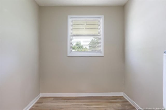 408 Harril Cir, Spring Lake, NC 28390 - spare room featuring baseboards and light wood-style flooring