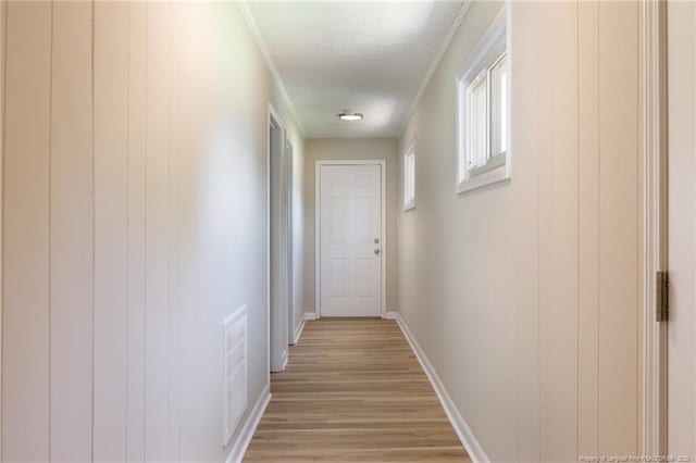 408 Harril Cir, Spring Lake, NC 28390 - hall featuring light wood finished floors, ornamental molding, baseboards, and a textured ceiling