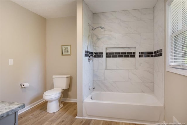 408 Harril Cir, Spring Lake, NC 28390 - full bathroom featuring toilet, baseboards, wood finished floors, vanity, and shower / washtub combination