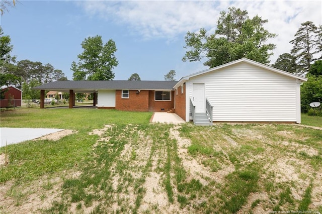 408 Harril Cir, Spring Lake, NC 28390 - rear view of house featuring entry steps, brick siding, and a lawn