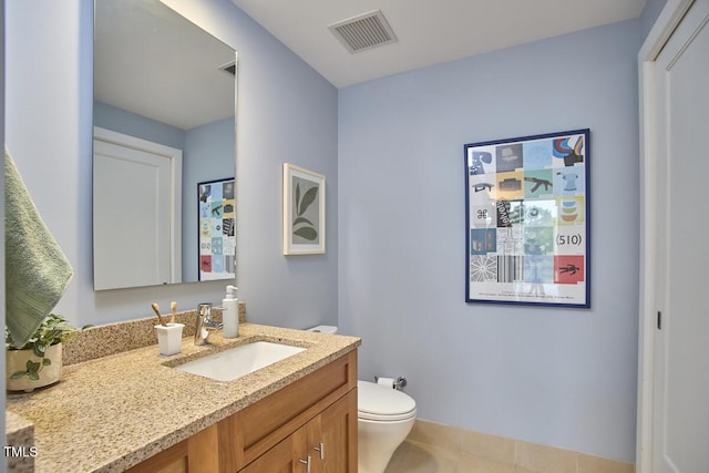 601 W Rosemary St Unit 416, Chapel Hill, NC 27516 - bathroom featuring toilet, vanity, tile patterned flooring, and baseboards