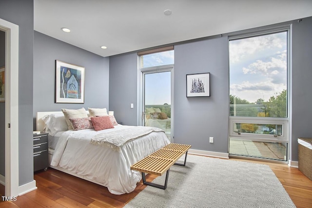 601 W Rosemary St Unit 416, Chapel Hill, NC 27516 - bedroom with wood finished floors, baseboards, and recessed lighting