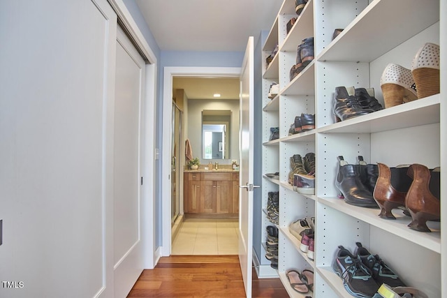 601 W Rosemary St Unit 416, Chapel Hill, NC 27516 - hall featuring light wood-style floors and a sink