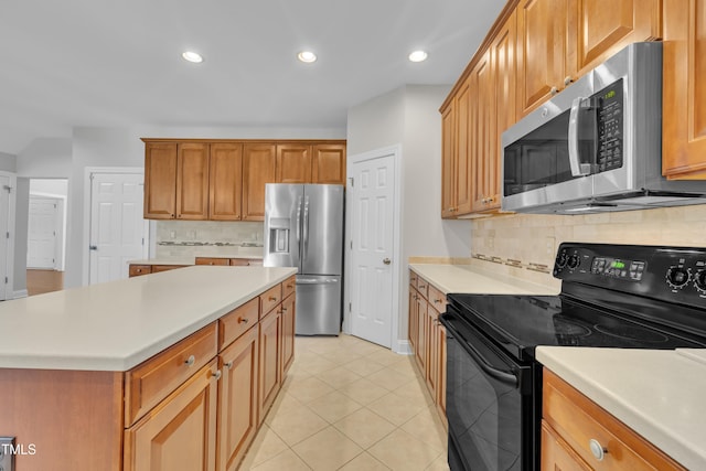 805 Alden Bridge Dr, Cary, NC 27519 - kitchen with appliances with stainless steel finishes, light countertops, backsplash, light tile patterned floors, and recessed lighting