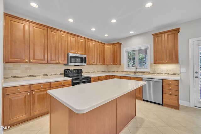 805 Alden Bridge Dr, Cary, NC 27519 - kitchen with stainless steel appliances, a sink, light countertops, backsplash, and recessed lighting