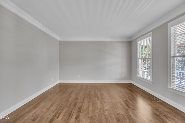 805 Alden Bridge Dr, Cary, NC 27519 - empty room with wood finished floors, crown molding, and baseboards