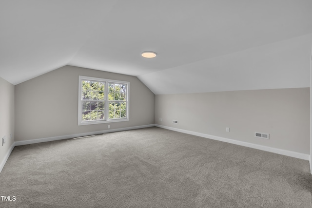 805 Alden Bridge Dr, Cary, NC 27519 - additional living space featuring baseboards, carpet floors, and vaulted ceiling