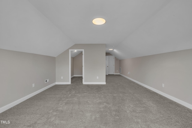 805 Alden Bridge Dr, Cary, NC 27519 - additional living space with carpet flooring, vaulted ceiling, and baseboards