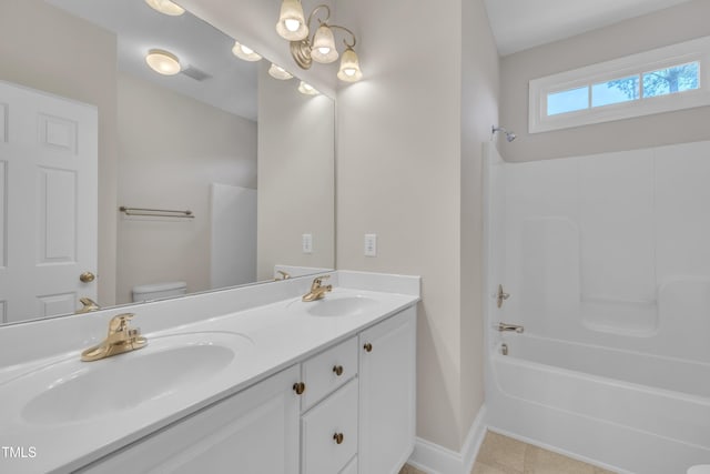 805 Alden Bridge Dr, Cary, NC 27519 - bathroom featuring double vanity, toilet, baseboards, and bathing tub / shower combination