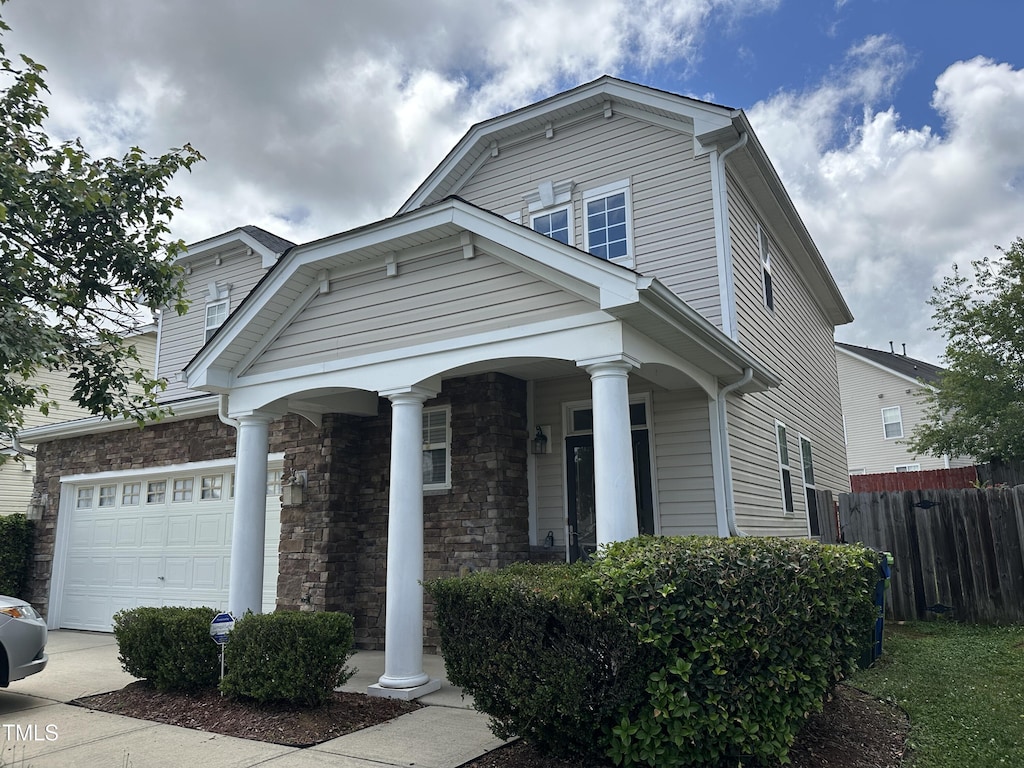 3124 Mackinac Island Ln, Raleigh, NC 27610 - dutch colonial with an attached garage and covered porch