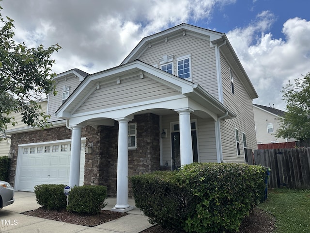 3124 Mackinac Island Ln, Raleigh, NC 27610 - dutch colonial with an attached garage and covered porch