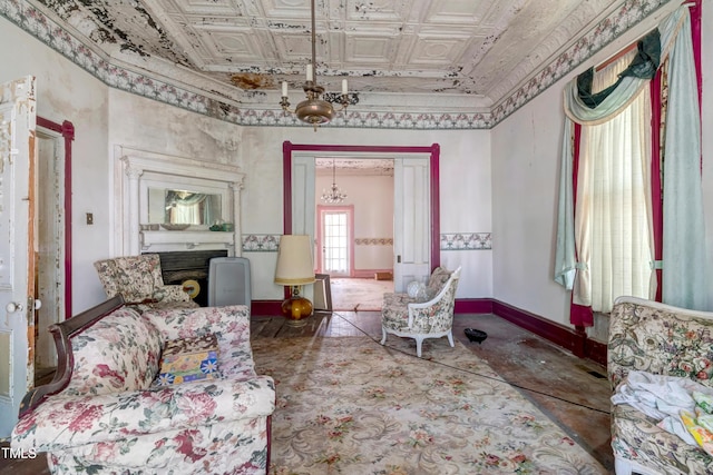 903 Nicholas St, Henderson, NC 27536 - living area with an ornate ceiling, baseboards, and a chandelier