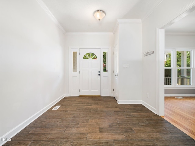 8312 Bellingham Cir, Raleigh, NC 27615 - foyer entrance with plenty of natural light, ornamental molding, dark wood-style floors, and baseboards