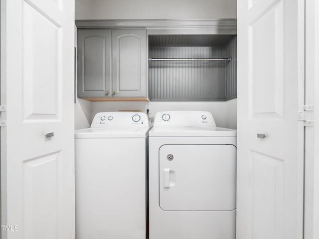8312 Bellingham Cir, Raleigh, NC 27615 - washroom with separate washer and dryer and cabinet space