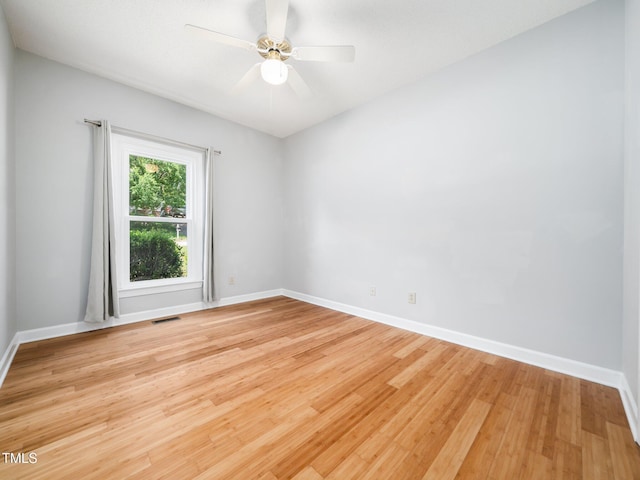 8312 Bellingham Cir, Raleigh, NC 27615 - unfurnished room with light wood finished floors, baseboards, and a ceiling fan