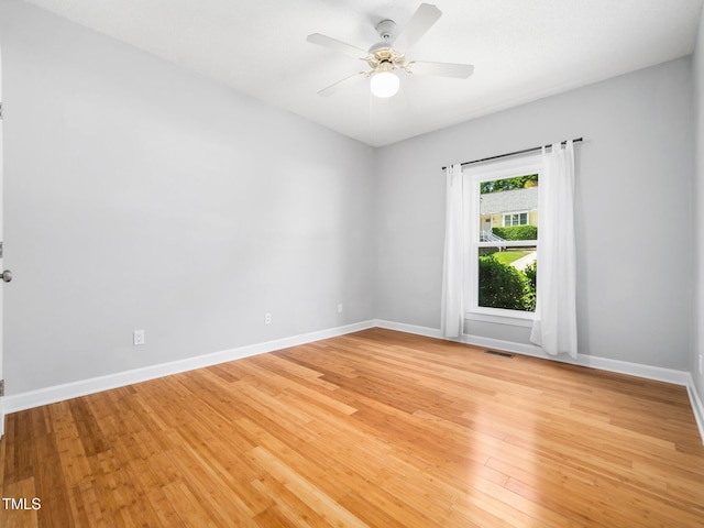 8312 Bellingham Cir, Raleigh, NC 27615 - unfurnished room with a ceiling fan, baseboards, and light wood-type flooring