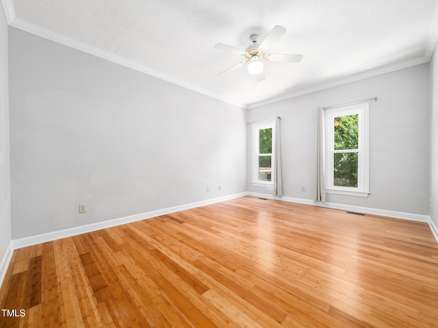 8312 Bellingham Cir, Raleigh, NC 27615 - unfurnished room featuring a ceiling fan, crown molding, light wood-type flooring, and baseboards