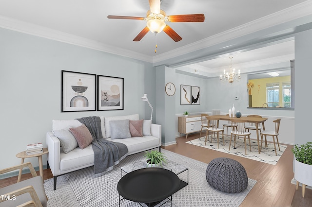 510 Berry Chase Way, Cary, NC 27519 - living area featuring ornamental molding, wood finished floors, a ceiling fan, baseboards, and a chandelier