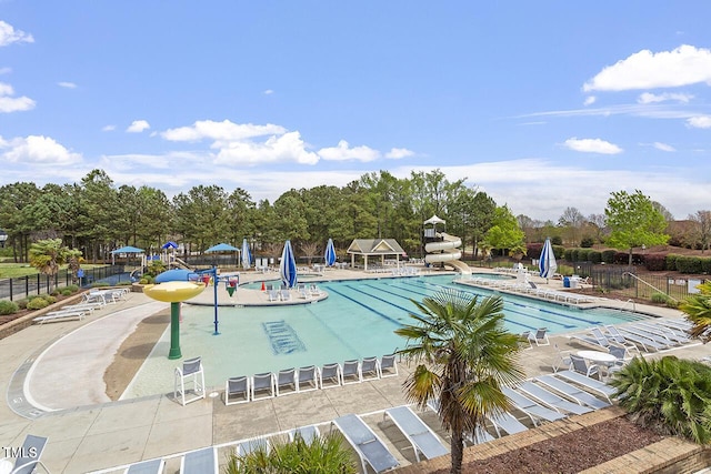 510 Berry Chase Way, Cary, NC 27519 - community pool with a water slide, a patio area, and view of wooded area