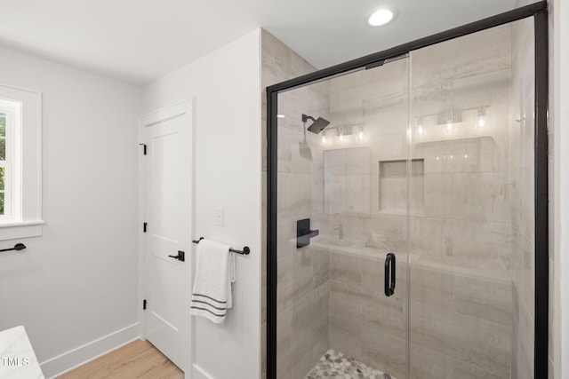 18 W Academy St, Wendell, NC 27591 - full bath featuring a shower stall, wood finished floors, and baseboards