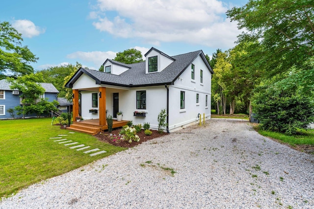 18 W Academy St, Wendell, NC 27591 - modern farmhouse style home featuring driveway, a front yard, a shingled roof, covered porch, and stucco siding
