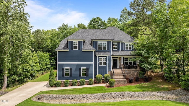 8304 Southmoor Hill Trl, Wake Forest, NC 27587 - view of front of property with stairway, a front lawn, a porch, a shingled roof, and driveway