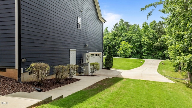 8304 Southmoor Hill Trl, Wake Forest, NC 27587 - view of home's exterior with a yard, concrete driveway, a garage, and a cooling unit