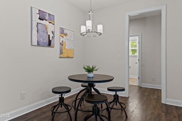 8304 Southmoor Hill Trl, Wake Forest, NC 27587 - dining area with a chandelier, baseboards, and dark wood-style floors