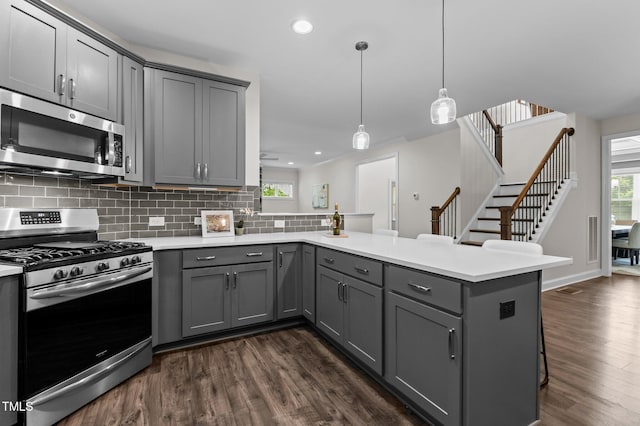 8304 Southmoor Hill Trl, Wake Forest, NC 27587 - kitchen featuring appliances with stainless steel finishes, gray cabinets, a peninsula, and recessed lighting
