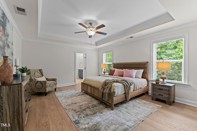 8304 Southmoor Hill Trl, Wake Forest, NC 27587 - bedroom with a raised ceiling, crown molding, light wood-style flooring, and baseboards