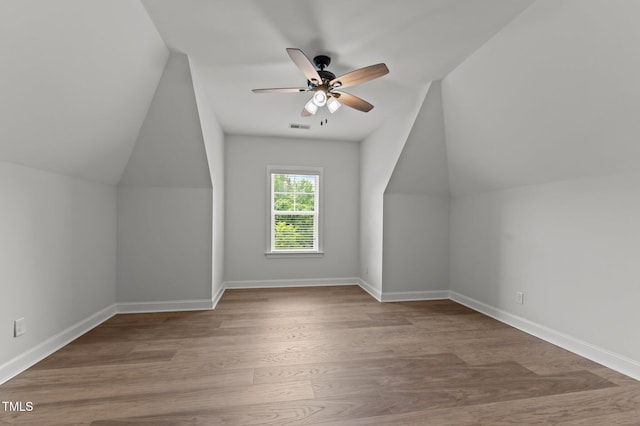 8304 Southmoor Hill Trl, Wake Forest, NC 27587 - bonus room featuring lofted ceiling, a ceiling fan, wood finished floors, and baseboards