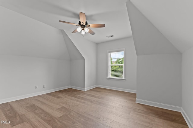 8304 Southmoor Hill Trl, Wake Forest, NC 27587 - bonus room with vaulted ceiling, wood finished floors, a ceiling fan, and baseboards