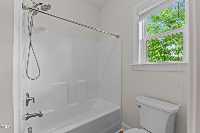 8304 Southmoor Hill Trl, Wake Forest, NC 27587 - bathroom with bathing tub / shower combination, toilet, and baseboards