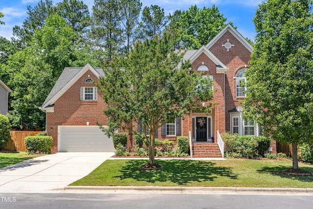 203 Worsham Dr, Chapel Hill, NC 27516 - view of front of home with brick siding, a garage, and concrete driveway