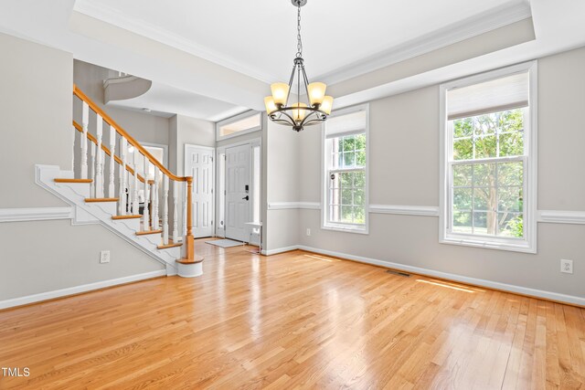 203 Worsham Dr, Chapel Hill, NC 27516 - foyer featuring ornamental molding, wood finished floors, a chandelier, stairs, and baseboards