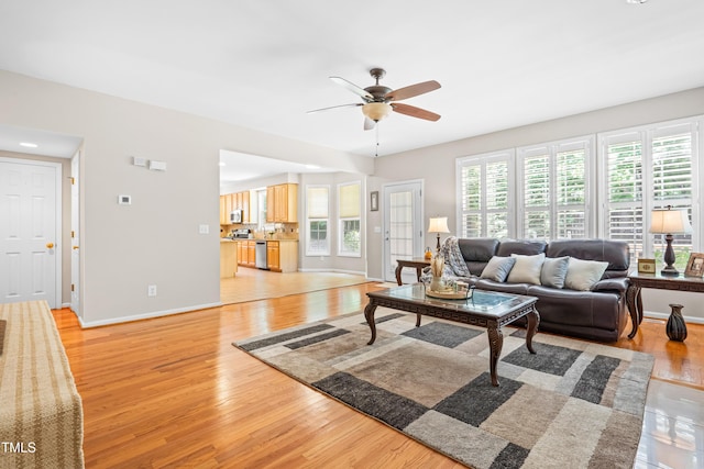 203 Worsham Dr, Chapel Hill, NC 27516 - living room featuring a ceiling fan, light wood-style flooring, and baseboards