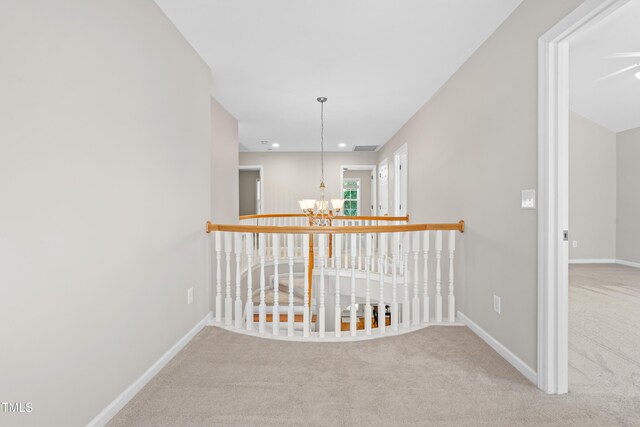 203 Worsham Dr, Chapel Hill, NC 27516 - hallway with a chandelier, carpet flooring, baseboards, and recessed lighting