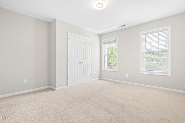 203 Worsham Dr, Chapel Hill, NC 27516 - unfurnished bedroom featuring baseboards, carpet floors, and a closet