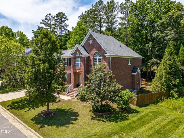 203 Worsham Dr, Chapel Hill, NC 27516 - view of front facade with brick siding and view of wooded area