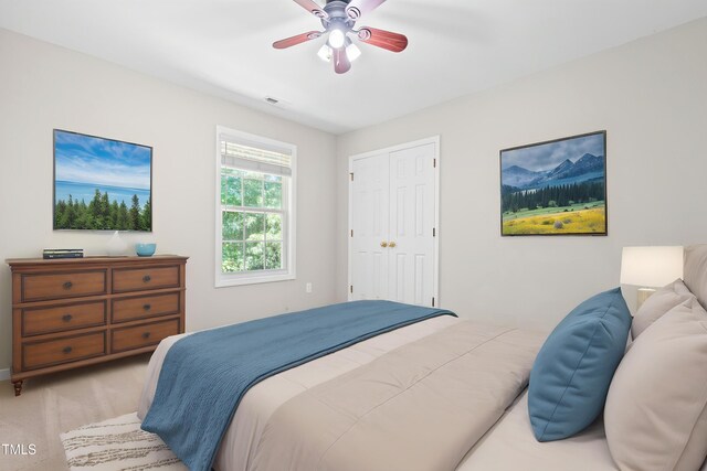 203 Worsham Dr, Chapel Hill, NC 27516 - bedroom with light carpet, a closet, and a ceiling fan