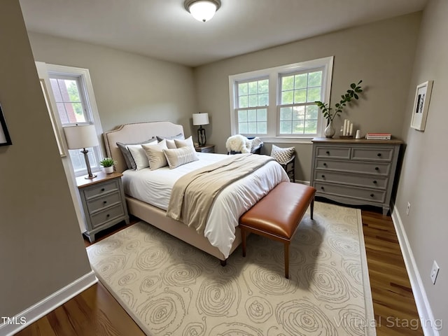 3804 Cobb St, Garner, NC 27529 - bedroom with multiple windows, dark wood finished floors, and baseboards