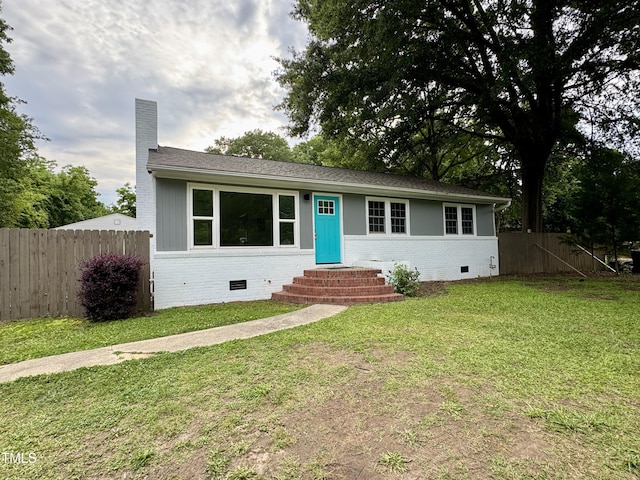 3804 Cobb St, Garner, NC 27529 - view of front facade featuring entry steps, brick siding, crawl space, and a chimney