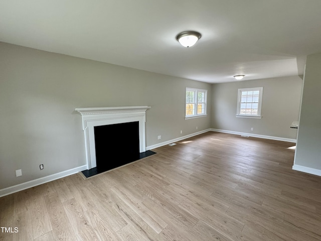 3804 Cobb St, Garner, NC 27529 - unfurnished living room with wood finished floors, baseboards, and a fireplace