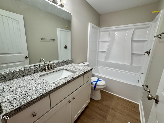 3804 Cobb St, Garner, NC 27529 - bathroom with toilet, wood finished floors, vanity, and shower / washtub combination